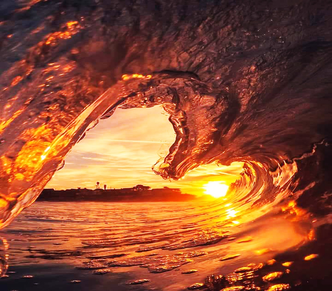 frozen wave against sunlight in the shape of a heart