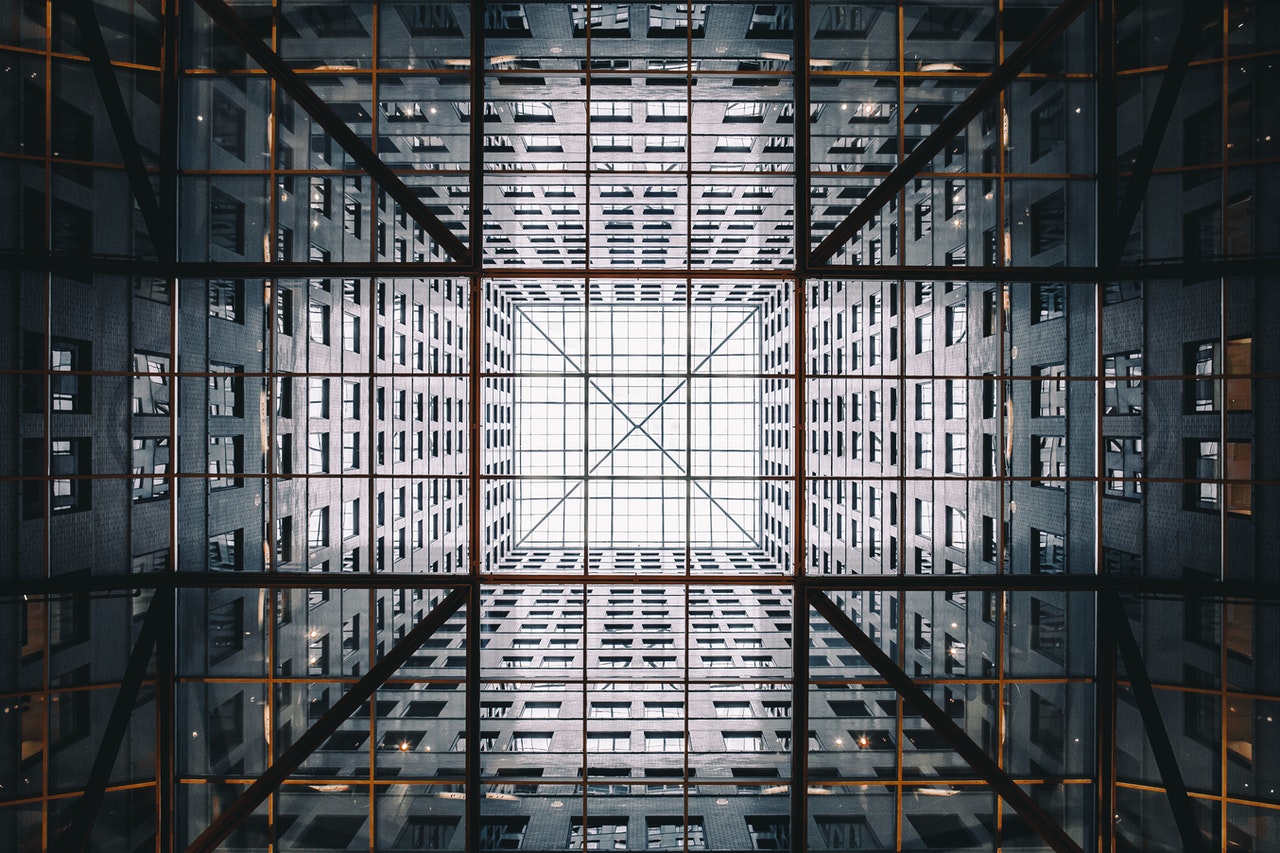 low angle shot of high rise building with a cross shape