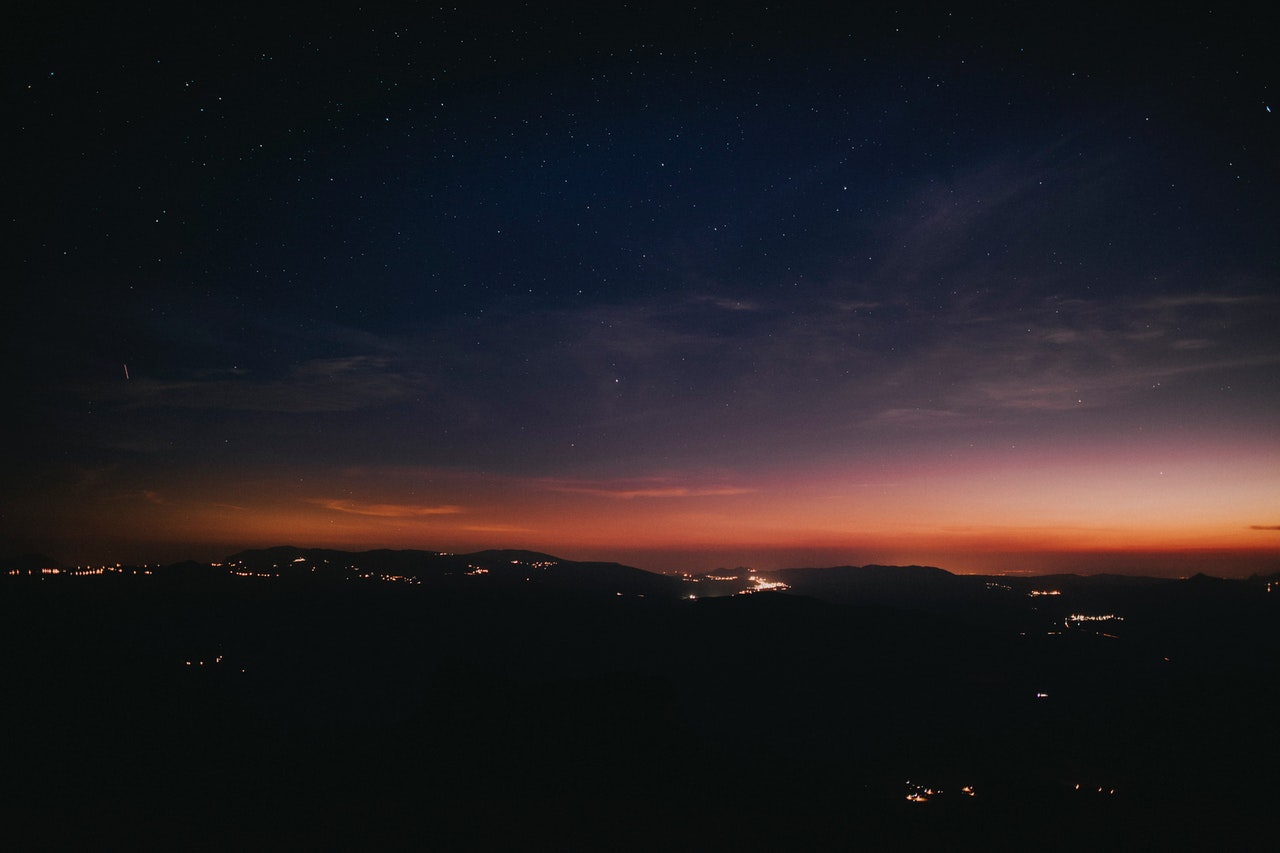 silhouette of mountain range during nighttime