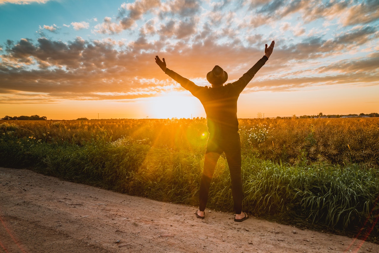 man in long sleeve shirt worships the Lord 